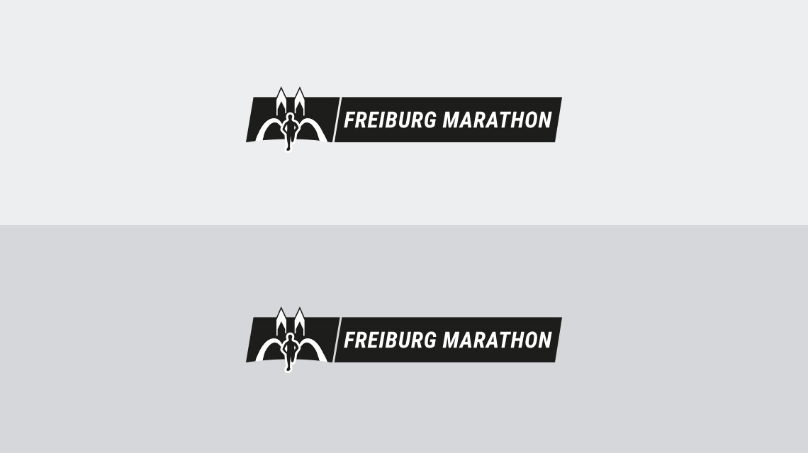 Logo Freiburg Marathon neu in Schwarz auf Hellgrau und Dunkelgrau