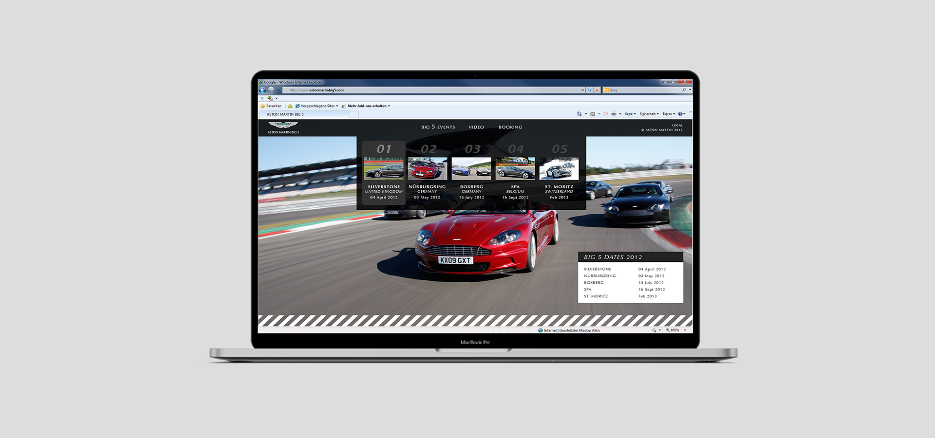 Ansicht der Website der Aston Martin Big 5 auf einem Notebook vor grauem Hintergrund