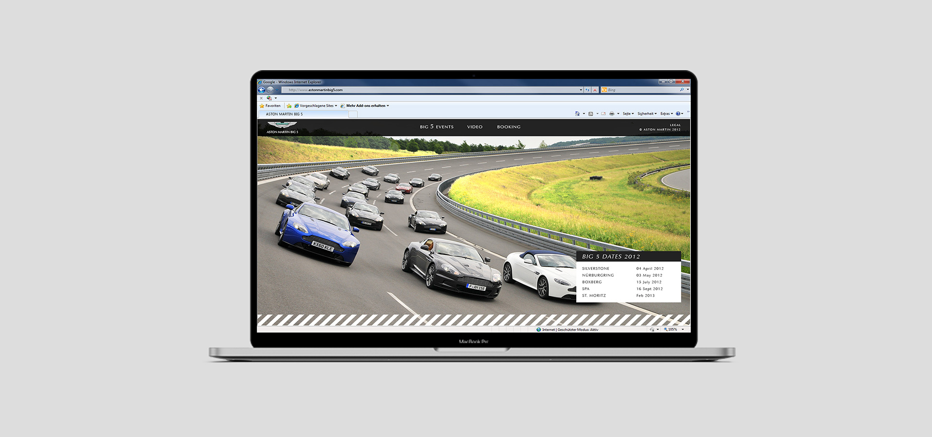 Ansicht der Website der Aston Martin Big 5 auf einem Notebook vor grauem Hintergrund