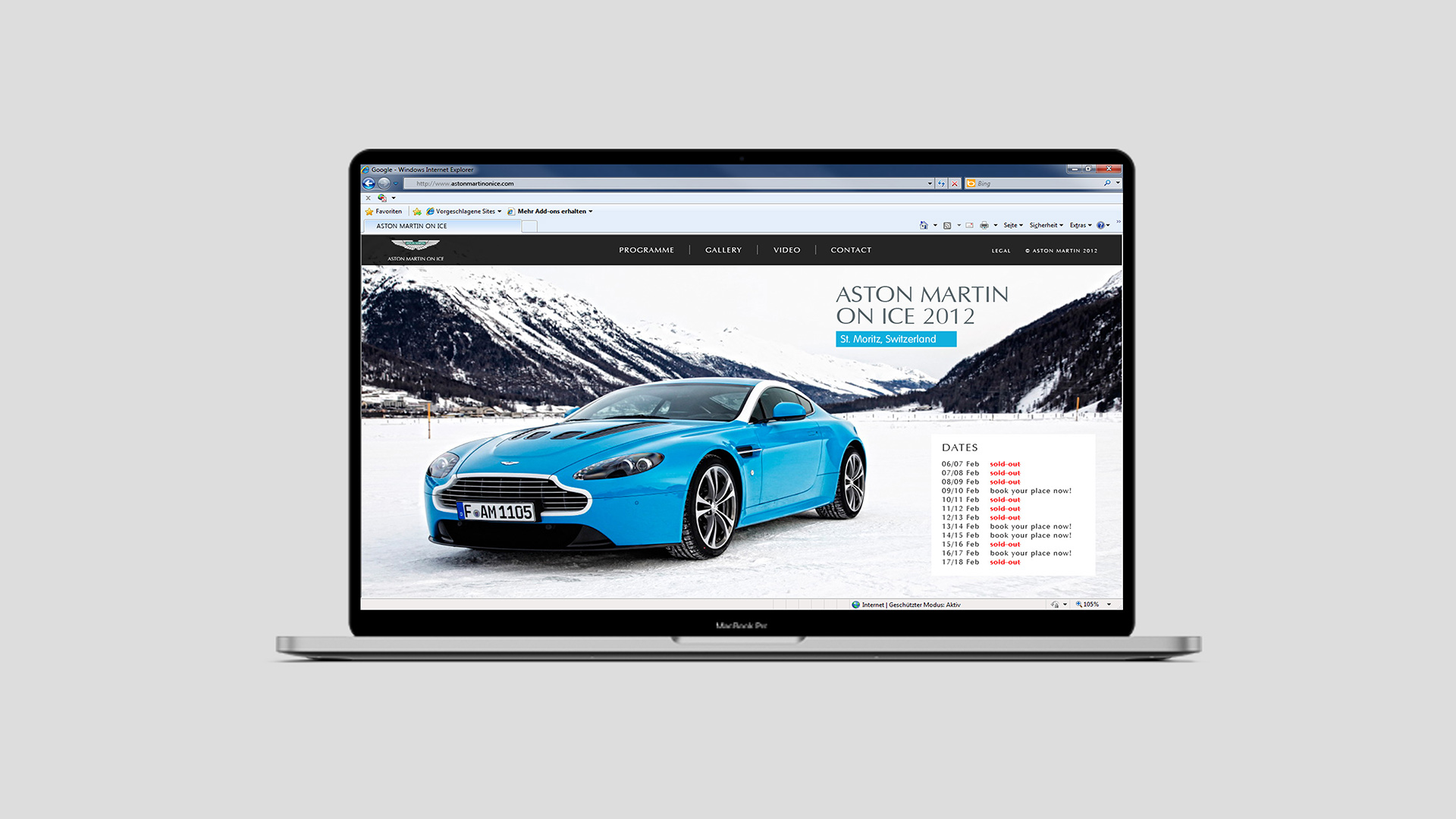 Ansicht der Webseite von Aston Martin On Ice auf einem Notebook auf grauem Hintergrund