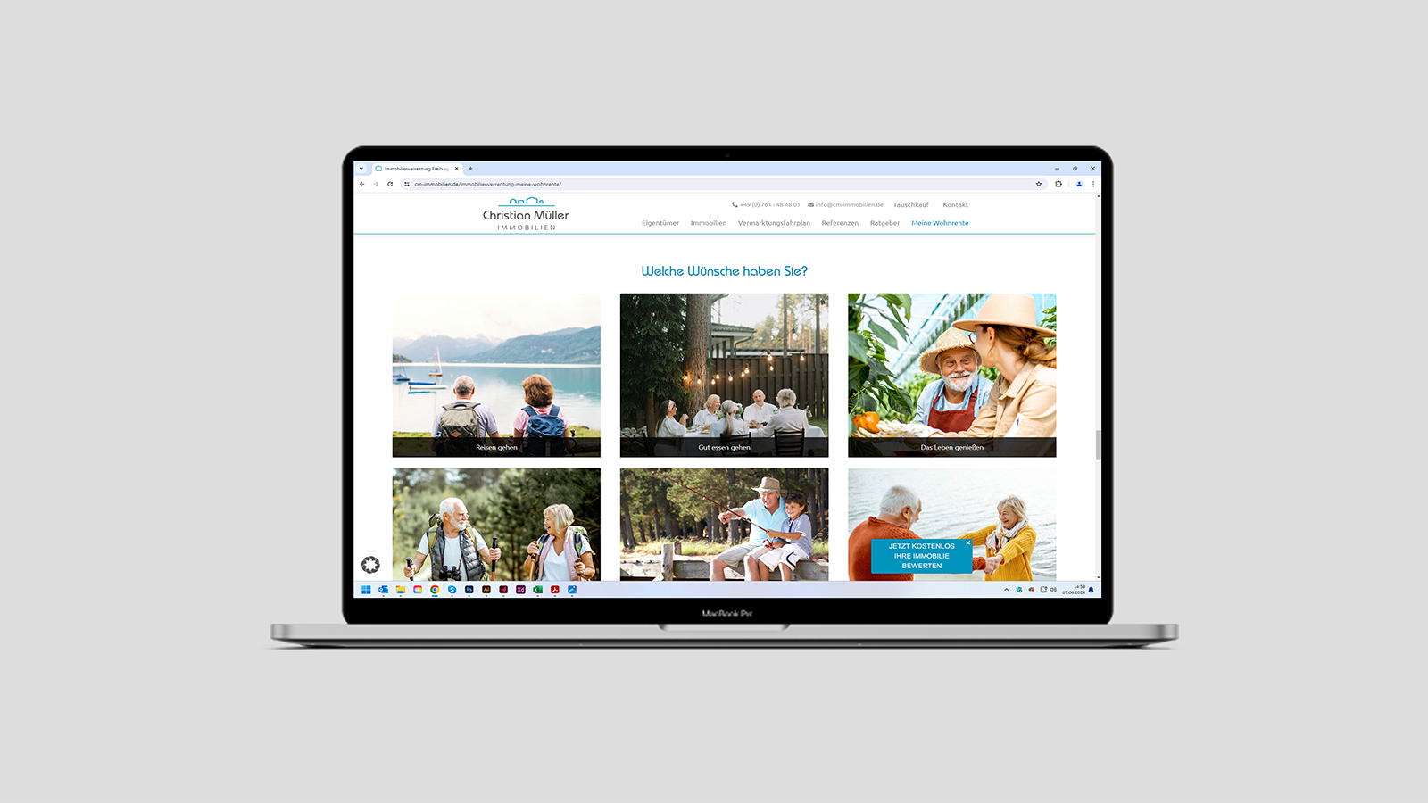 Ansicht einer Unterseite der Webseite von Christian Müller Immobilien auf einem Notebook vor grauem Hintergrund