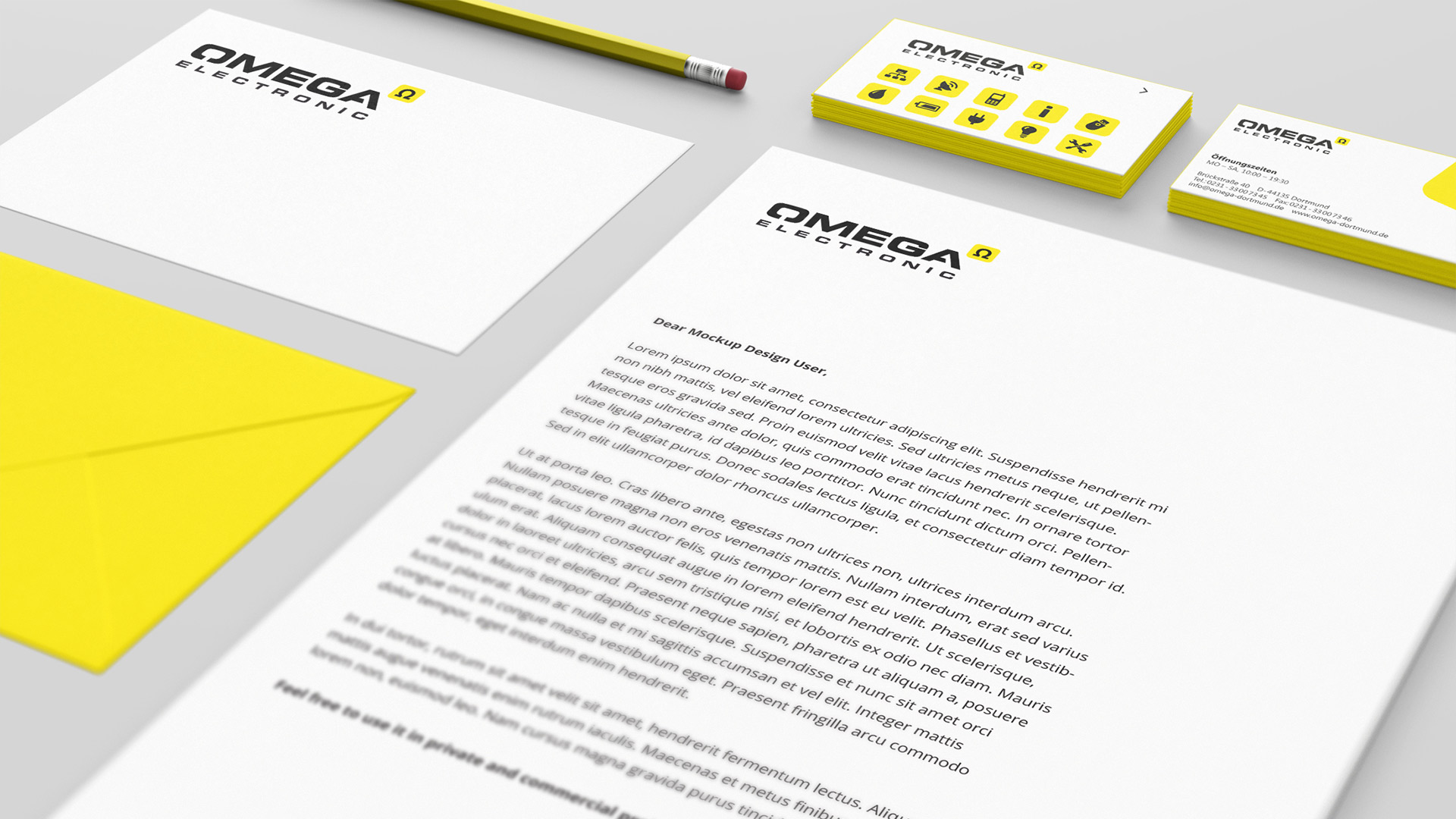 Nahaufnahme Briefpapier, Vorder- und Rückseite Visitenkarten und Briefumschlag von Omega Electronics