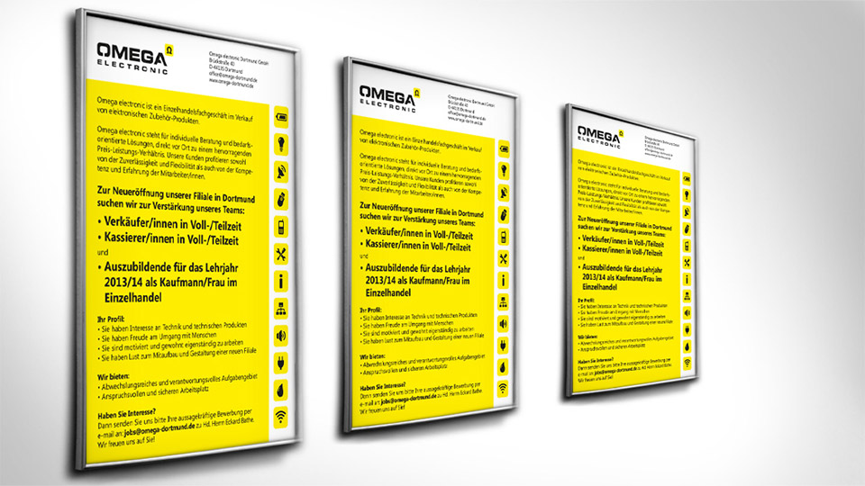 Ansicht dreier Poster von Omega Electronics an einer weißen Wand